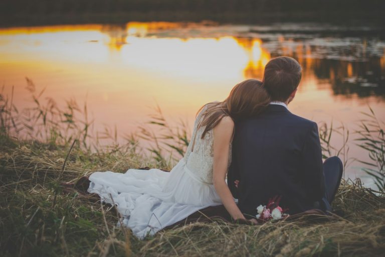 Couple sitting together watching the sunset